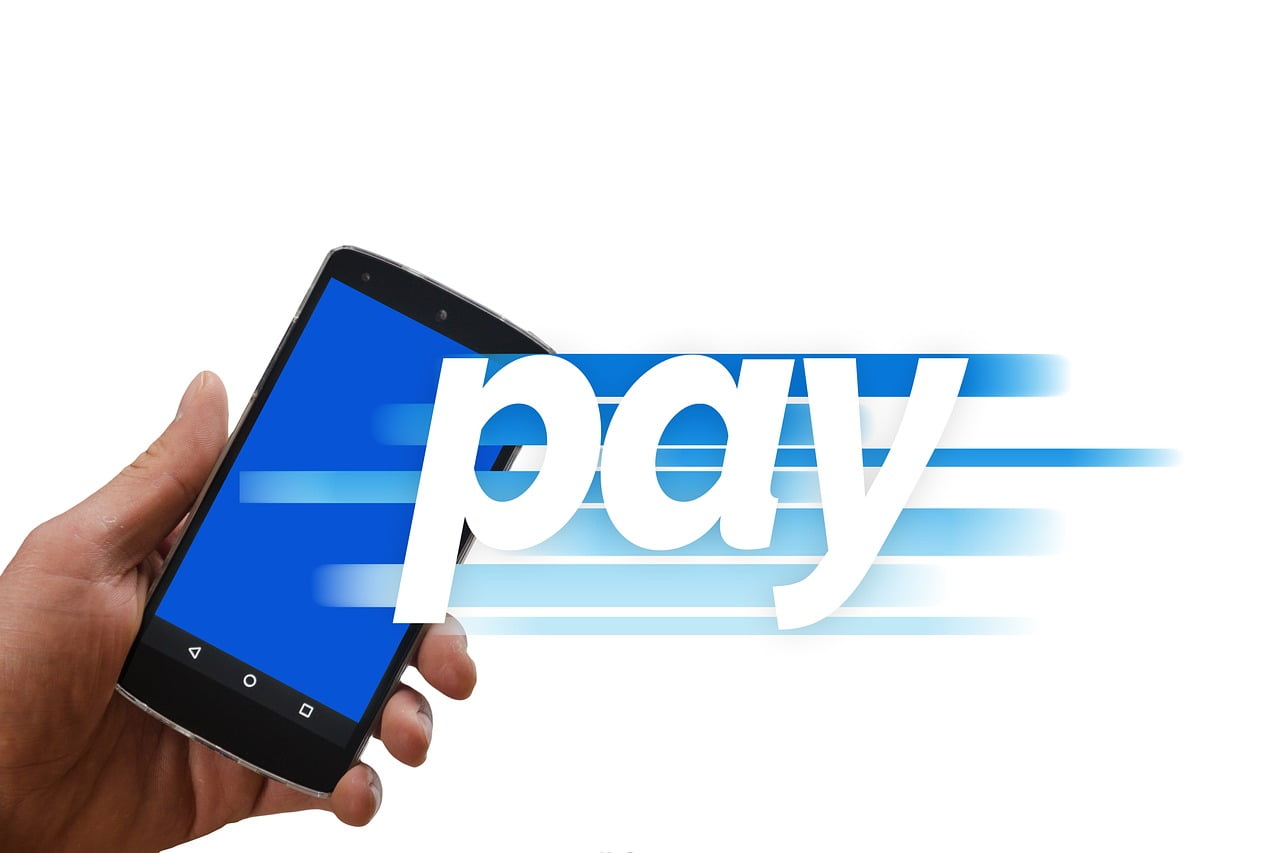 An image of a phone with the word pay