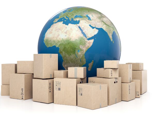 Packages in front of an image of a globe.